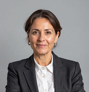 Smiling woman in professional attire portrait.